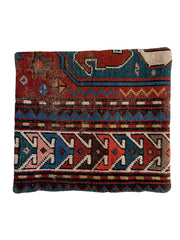Caucasian hand-knotted vintage rug wool pillow in red with blue orange, green and cream accents.
