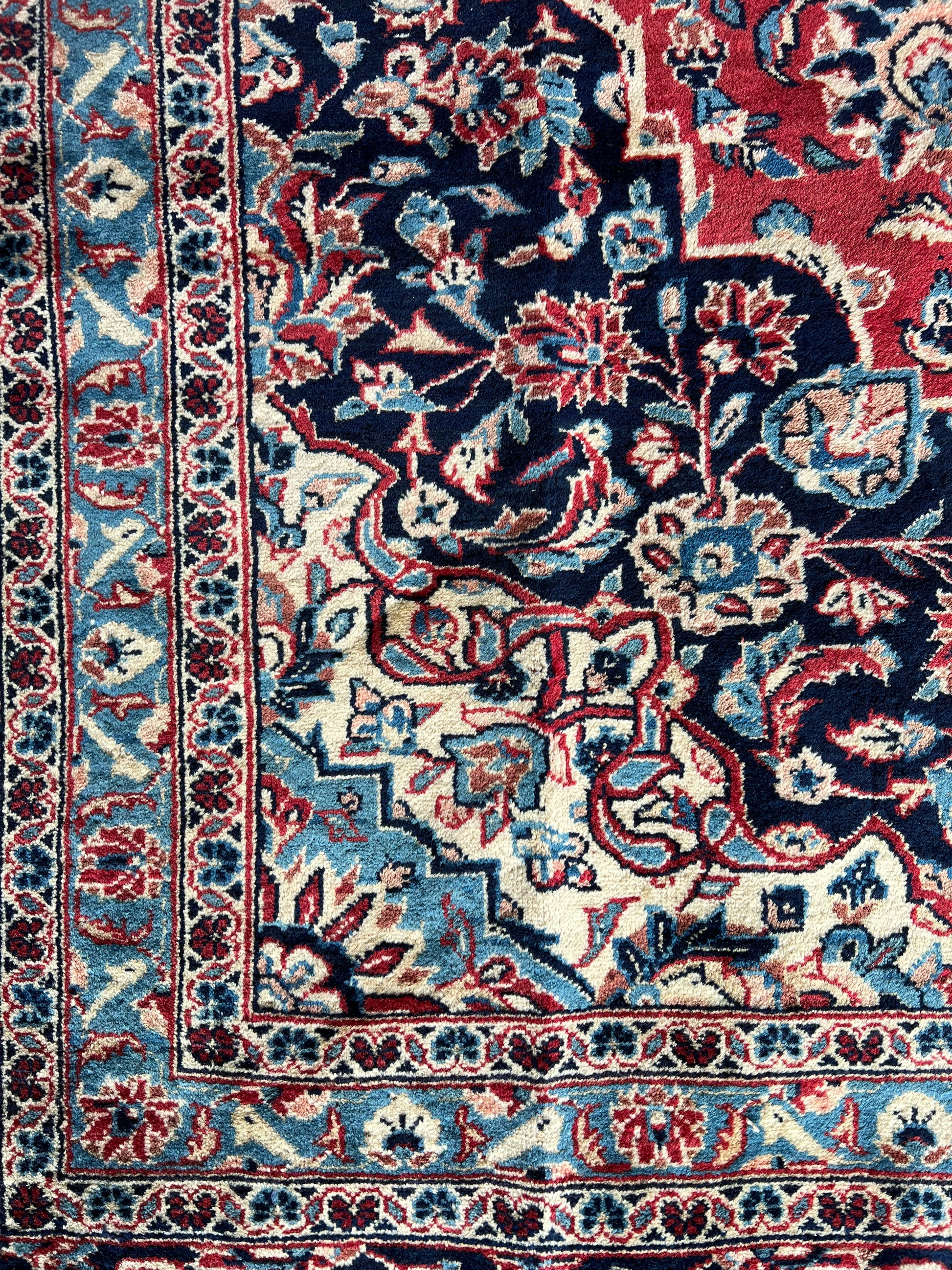 Close-up corner of Lachlan Persian Kashan rug, highlighting detailed hand-knotted border and craftsmanship