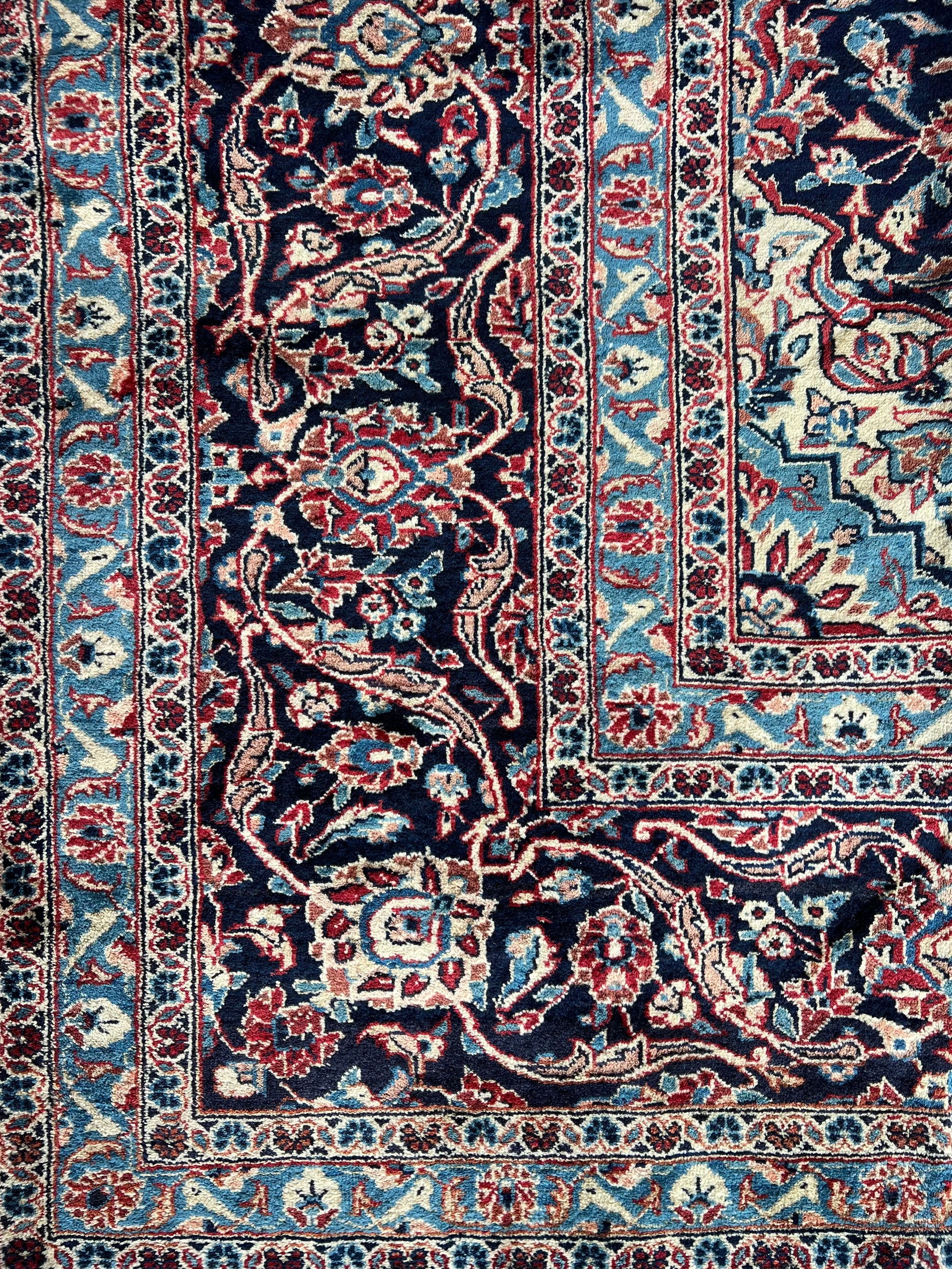 Corner of Lachlan Persian Kashan rug, highlighting detailed hand-knotted border and craftsmanship.