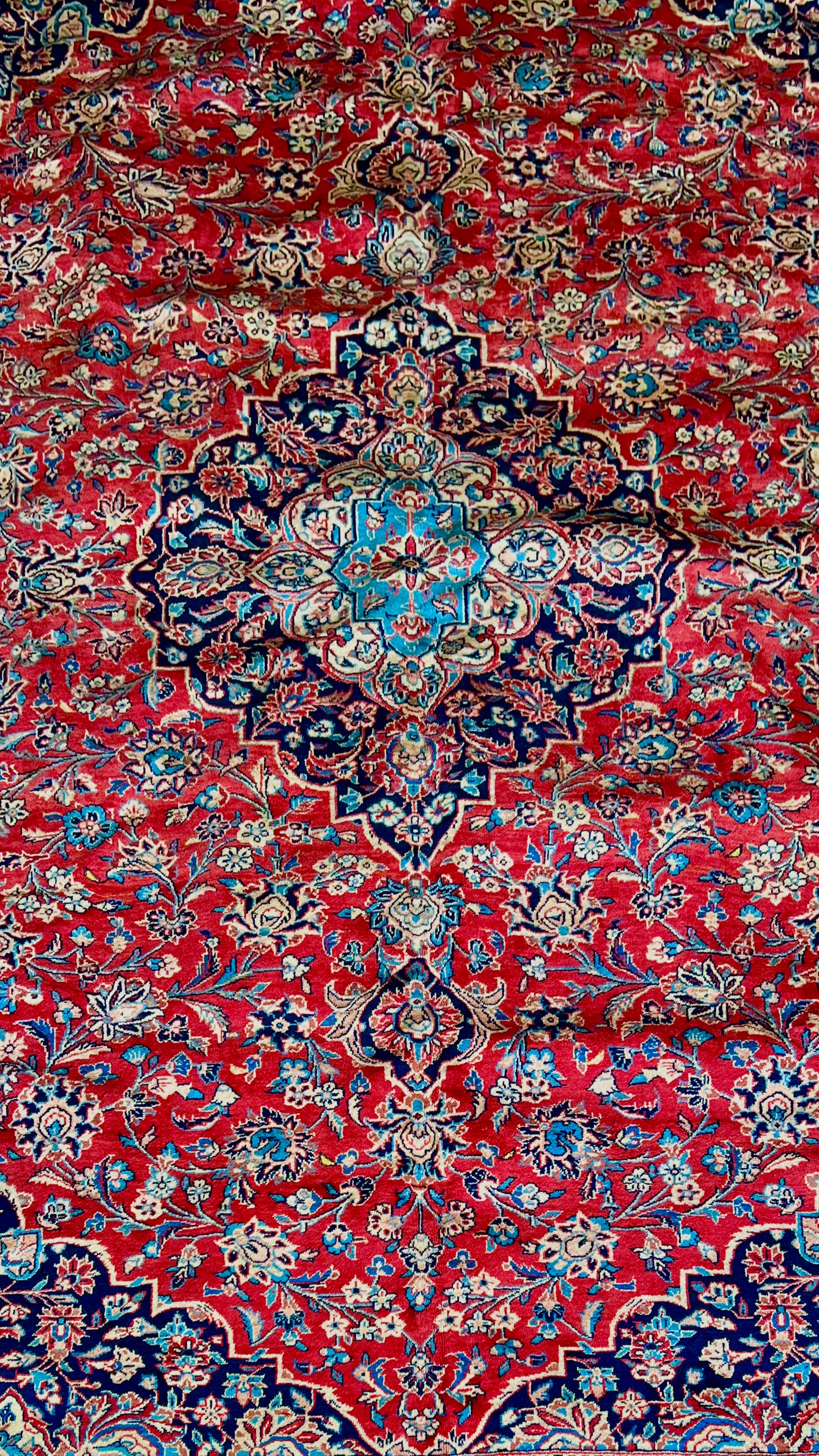 Lachlan Persian Kashan rug central medallion, showing intricate floral motifs and knot detail
