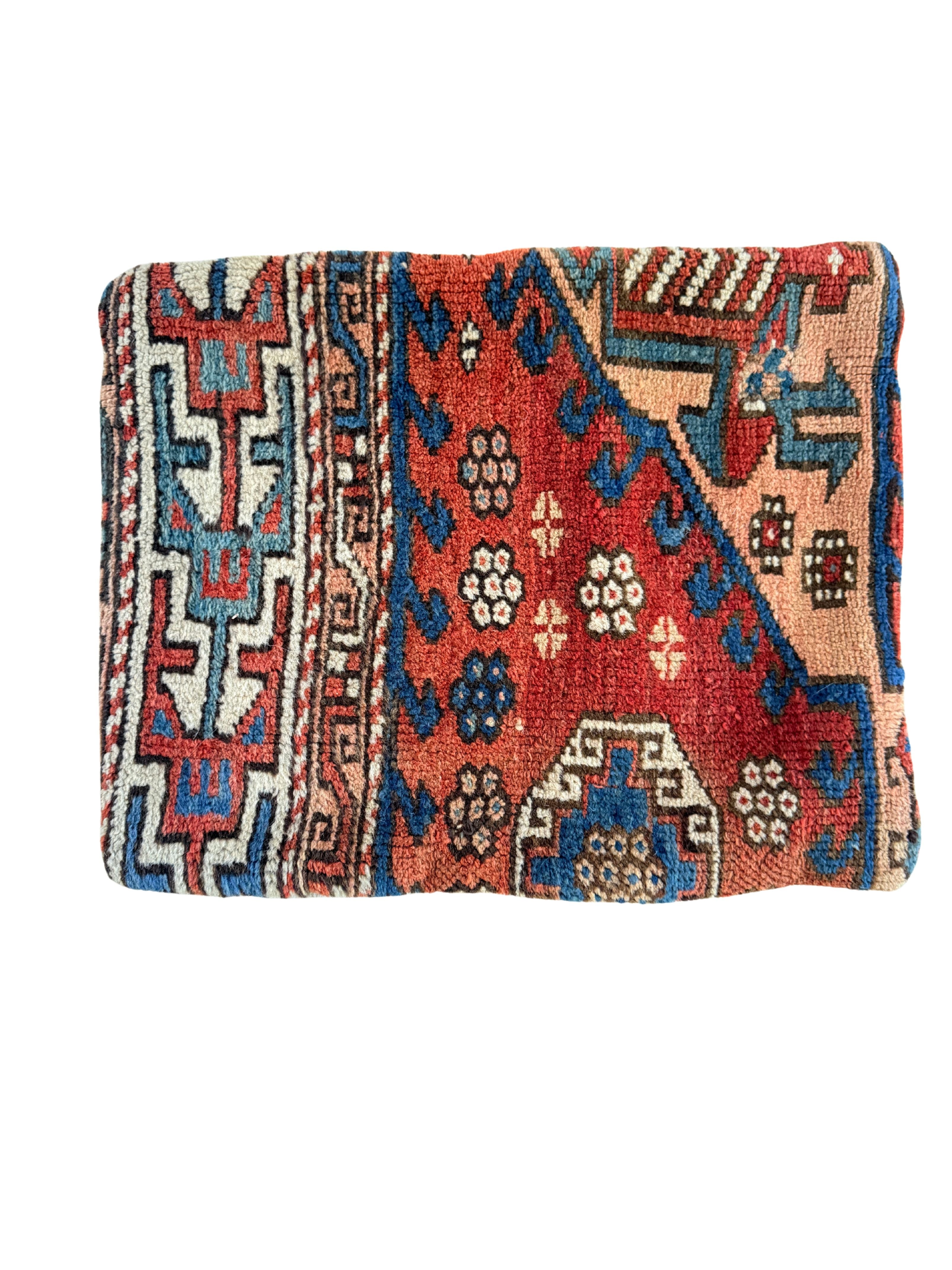 vintage rug pillow crafted from handwoven wool with shades of red, blues, apricot and teal.